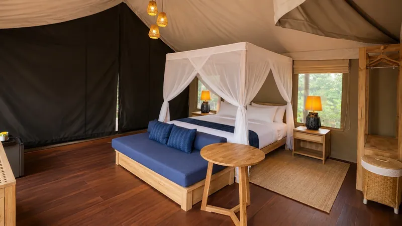 Doi Phu Kha tent with a canopy bed and mountain window