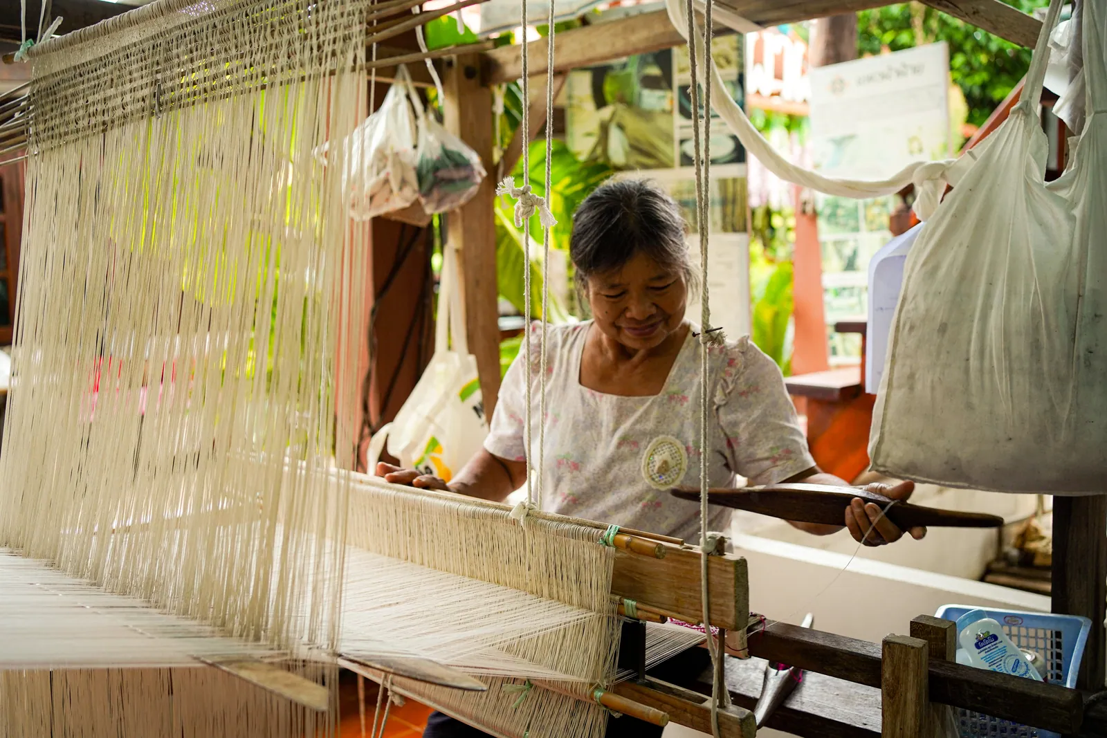 A Tai Lue weaver at her loom